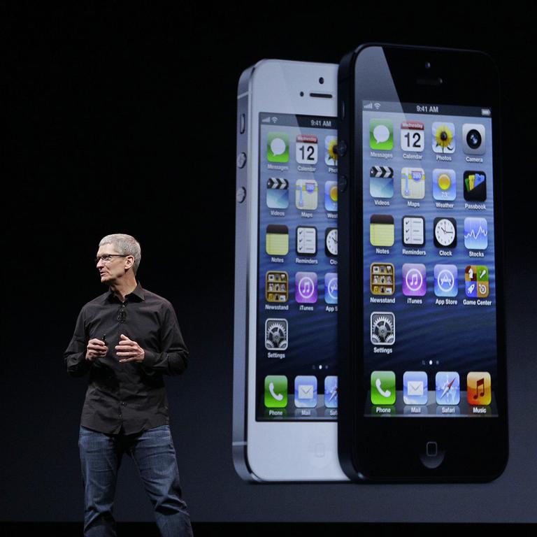 Apple CEO Tim Cook introducing the iPhone 5 in 2012, the first iPhone to be unveiled after the death of Steve Jobs.