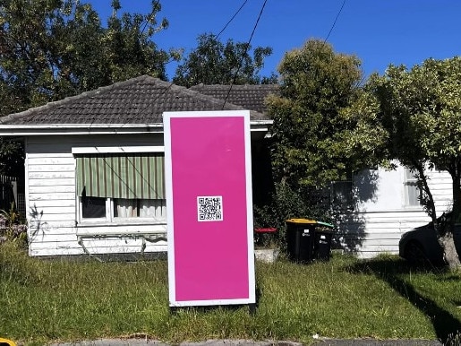 A Melbourne house with a pink billboard out the front has gone viral. Picture: Reddit