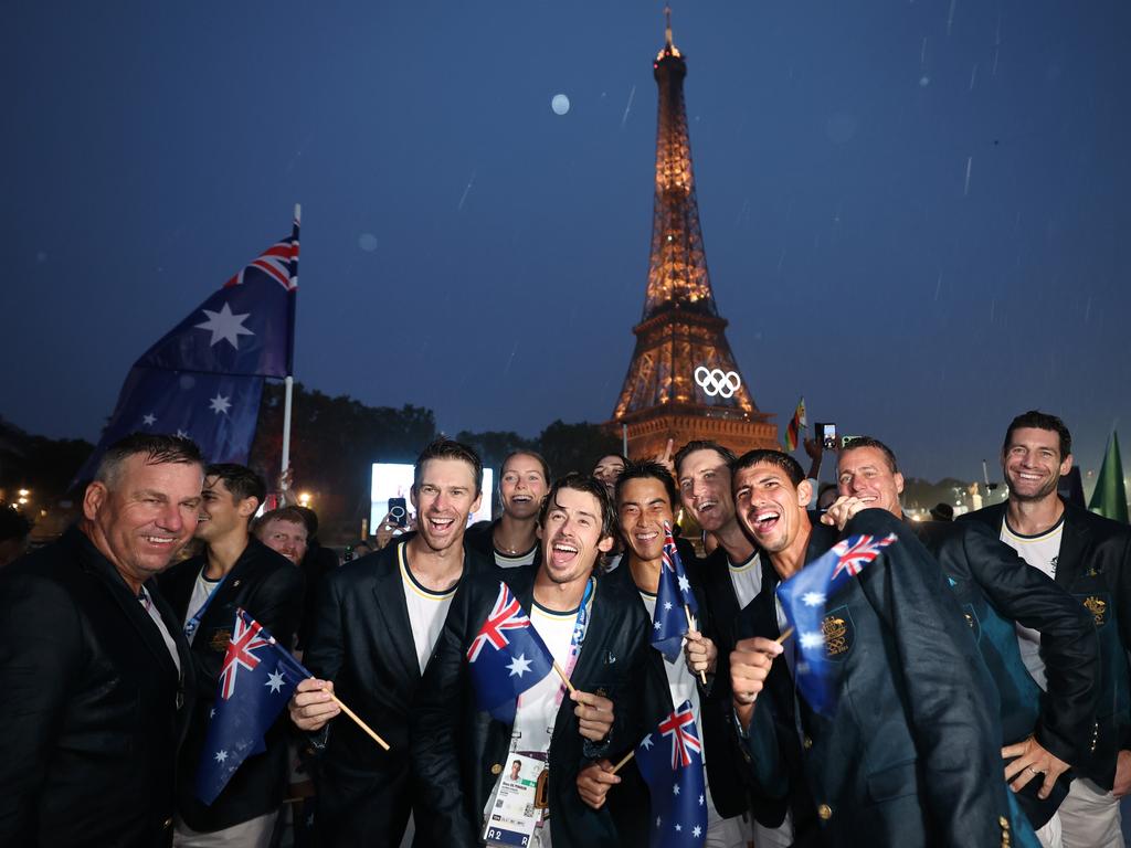 PARIS, FRANCE - JULY 26: Athletes of Team Australia react in front of the Eiffel Tower during the opening ceremony of the Olympic Games Paris 2024 on July 26, 2024 in Paris, France. (Photo by Quinn Rooney/Getty Images)