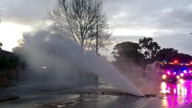 The burst water main sent water gushing on to a house at Robson St, Hectorville, on Tuesday evening. Picture: David Watts