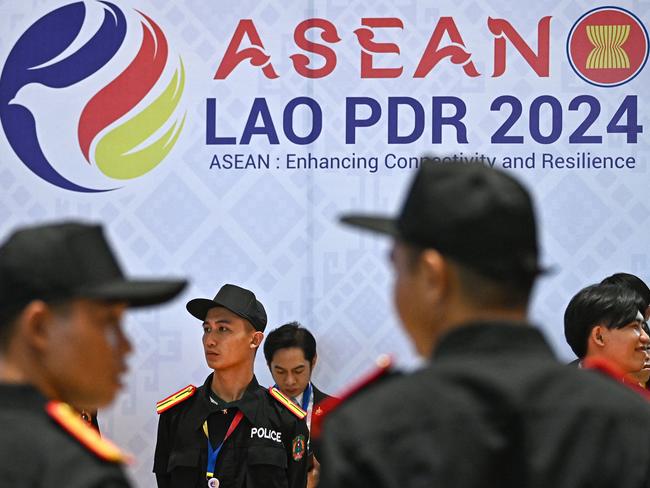 Security officials look on during the 44th and 45th Association of Southeast Asian Nations (ASEAN) Summits in Vientiane on October 9, 2024. (Photo by NHAC NGUYEN / AFP)