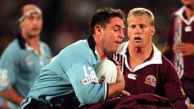 Brad Fittler is tackled.