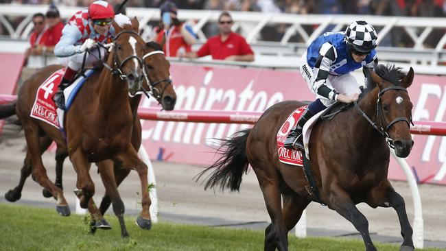 Melbourne Cup Day 2014 Main Race at Flemington Racecourse. Winner German horse Protectionist with rider Ryan Moore head the field to the finish line. Picture: David Caird.