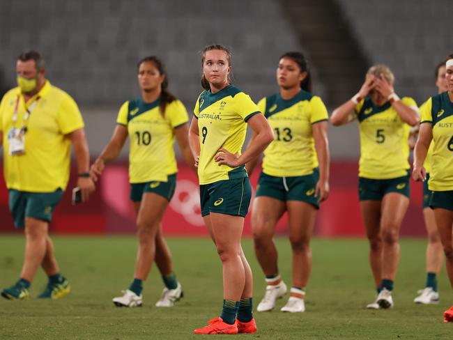 CHOFU, JAPAN - JULY 30:  Tia Hinds of Team Australia and team mates look dejected at full time in the WomenÃ¢â¬â¢s Quarter Final match between Team Fiji and Team Australia during the Rugby Sevens on day seven of the Tokyo 2020 Olympic Games at Tokyo Stadium on July 30, 2021 in Chofu, Tokyo, Japan. (Photo by Dan Mullan/Getty Images)