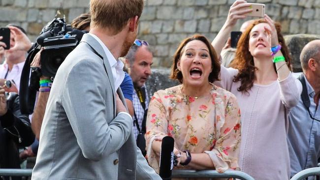 Lisa Millar gets Prince Harry's attention the night before his wedding at Windsor Castle in 2018.