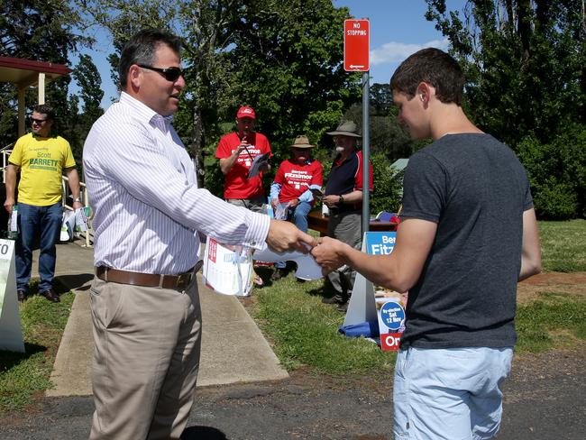 The Shooters, Fishers and Farmers Party candidate handing out how-to-vote cards yesterday. Picture: Jonathan Ng