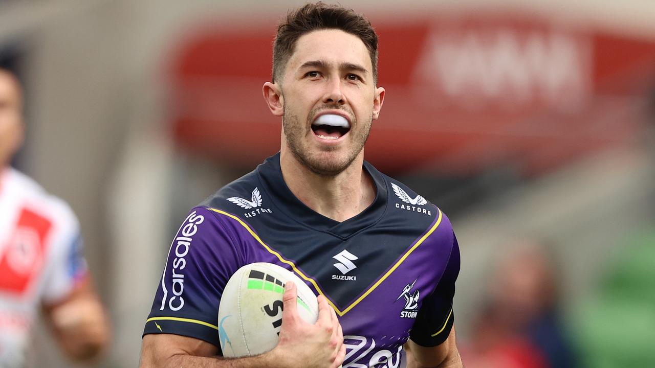 MELBOURNE, AUSTRALIA - MAY 08: Nick Meaney of the Storm makes a break on ho\\is way to scoring a try during the round nine NRL match between the Melbourne Storm and the St George Illawarra Dragons at AAMI Park, on May 08, 2022, in Melbourne, Australia. (Photo by Robert Cianflone/Getty Images)