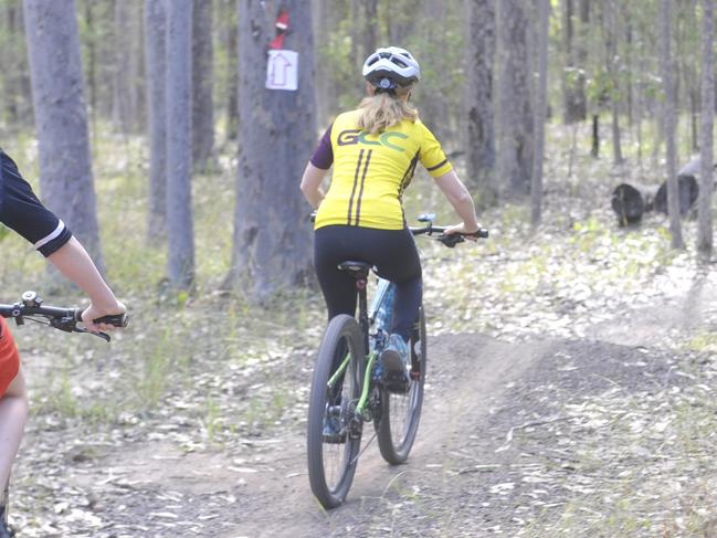 Clarence MP Chris Gulaptis at the Bom Bom Forest Mountain Bike Park to announce a $128,000 upgrade to the trails. Grafton Cycle Club president Grant Hodgins and Michelle Newstead were also on hand. Photo: Mitchell Keenan