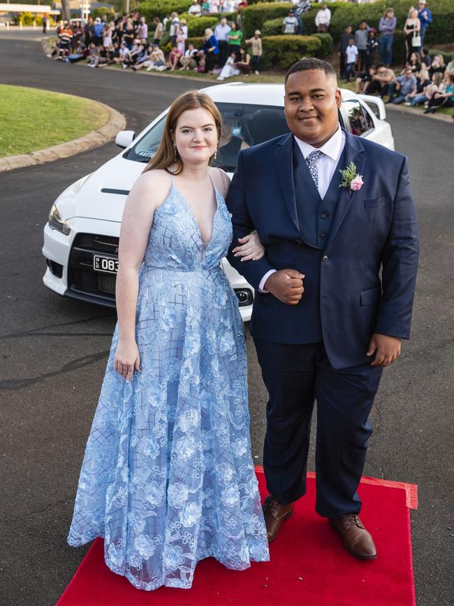 Lizzie Pidgeon and Pedro Dos Passos arrive at Harristown State High School formal at Highfields Cultural Centre, Friday, November 18, 2022. Picture: Kevin Farmer