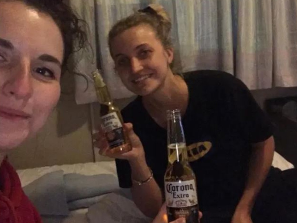 Julia and friend Dina enjoy a corona beer while being held up in quarantine at Heathrow Airport. Picture: Julia Walentin