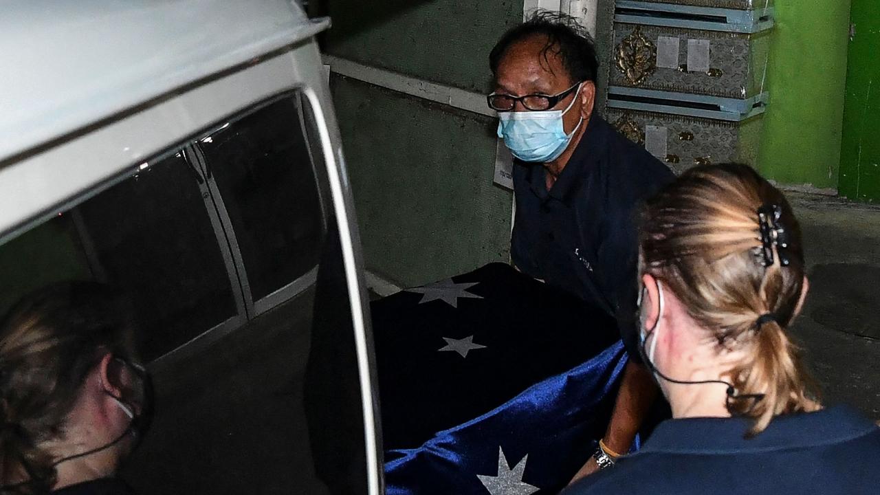 The coffin of Australian cricket player Shane Warne is loaded into a vehicle at the Police General Hospital in Bangkok. Photo by James WILSON / THAI NEWS PIX / AFP.
