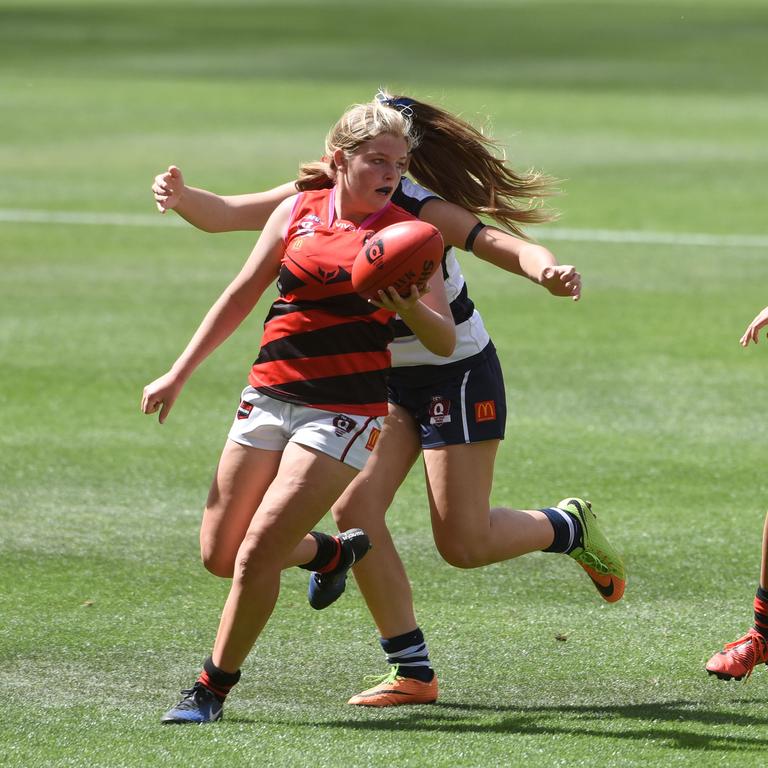 Junior under 15 Girls AFL Final between Broadbeach and Burleigh. Burleigh's Amity Bamberry and Broadbeach's Caitlin Wallis. (Photo/Steve Holland)