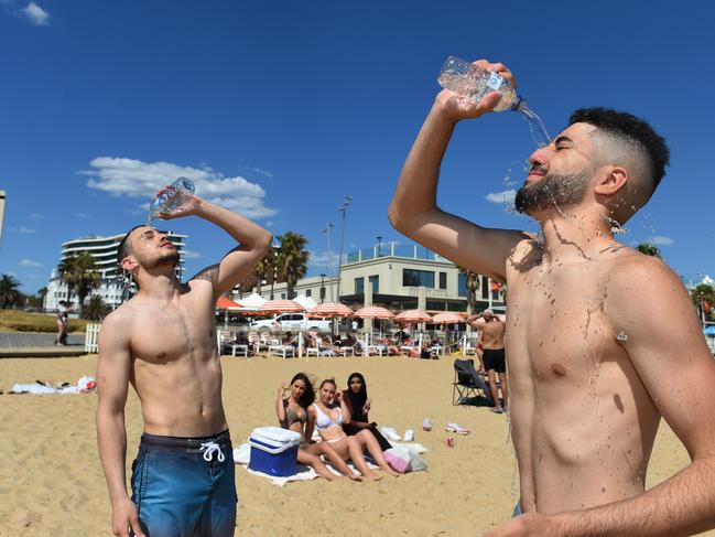 Ziyad Ezzat and Sulaiman Elleissy cool off at St Kilda beach. Picture: Josie Hayden