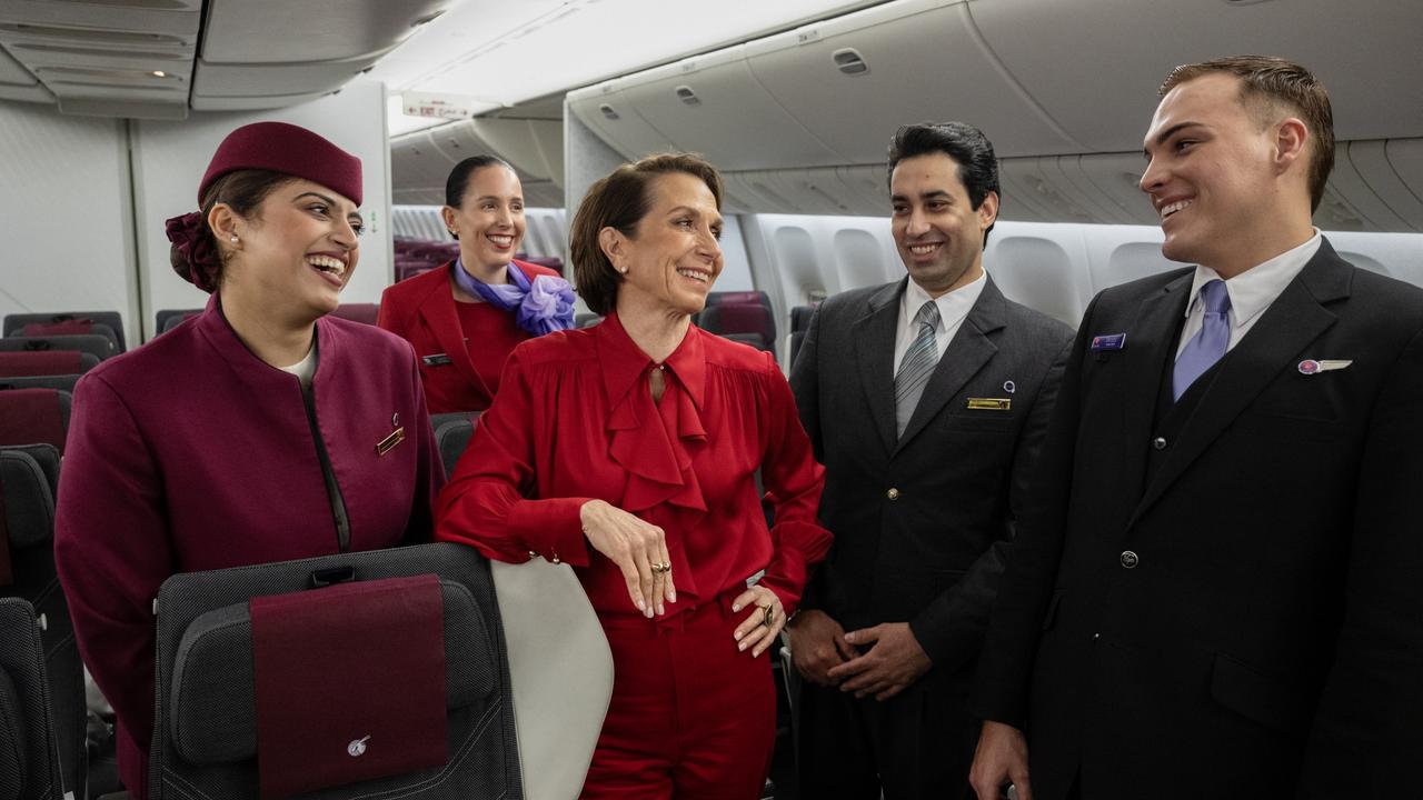 Ms Hrdlicka with crew from Qatar Airways and Virgin on board a Boeing 777. Picture: Getty Images