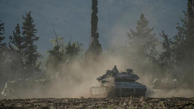 Israeli tanks and APC's gather by the Israeli - Lebanese border on September 30. Picture: AFP