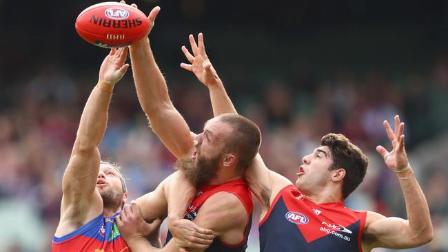 Christian Petracca goes third man up as Stefan Martin and Max Gawn compete in the ruck. The rule will be discussed at an AFL rules meeting this week.
