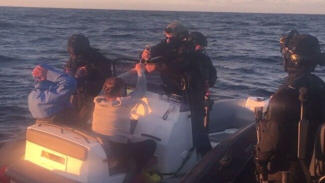 The dramatic arrest of Dru Baggaley on a boat. Picture: Supplied