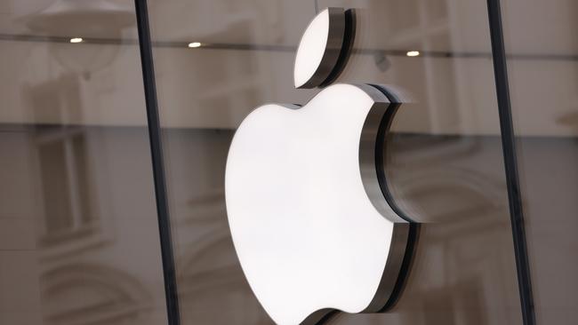 BERLIN, GERMANY - MARCH 25: The Apple logo hangs on an Apple Store on March 25, 2024 in Berlin, Germany. The European Commission is launching an investigation into Apple, Meta (the parent company of Facebook) and Alphabet (the parent company of Google) over whether the companies violate the new EU Digital Markets Act. (Photo by Sean Gallup/Getty Images)