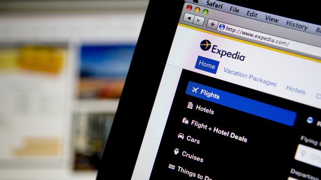 The Expedia Inc. homepage is displayed on laptop computers arranged for a photograph in Washington, D.C., U.S., on Tuesday, Oct. 29, 2013. Expedia Inc. is expected to release earnings figures on Oct. 30. Photographer: Andrew Harrer/Bloomberg