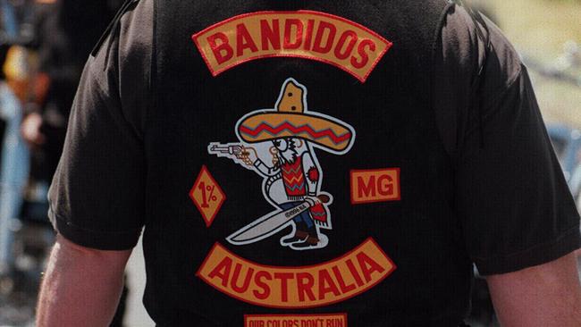 Rear view of Bandido bikie member attending national meeting in Geelong 10/97, excellent view of bikie patch on jacket. People