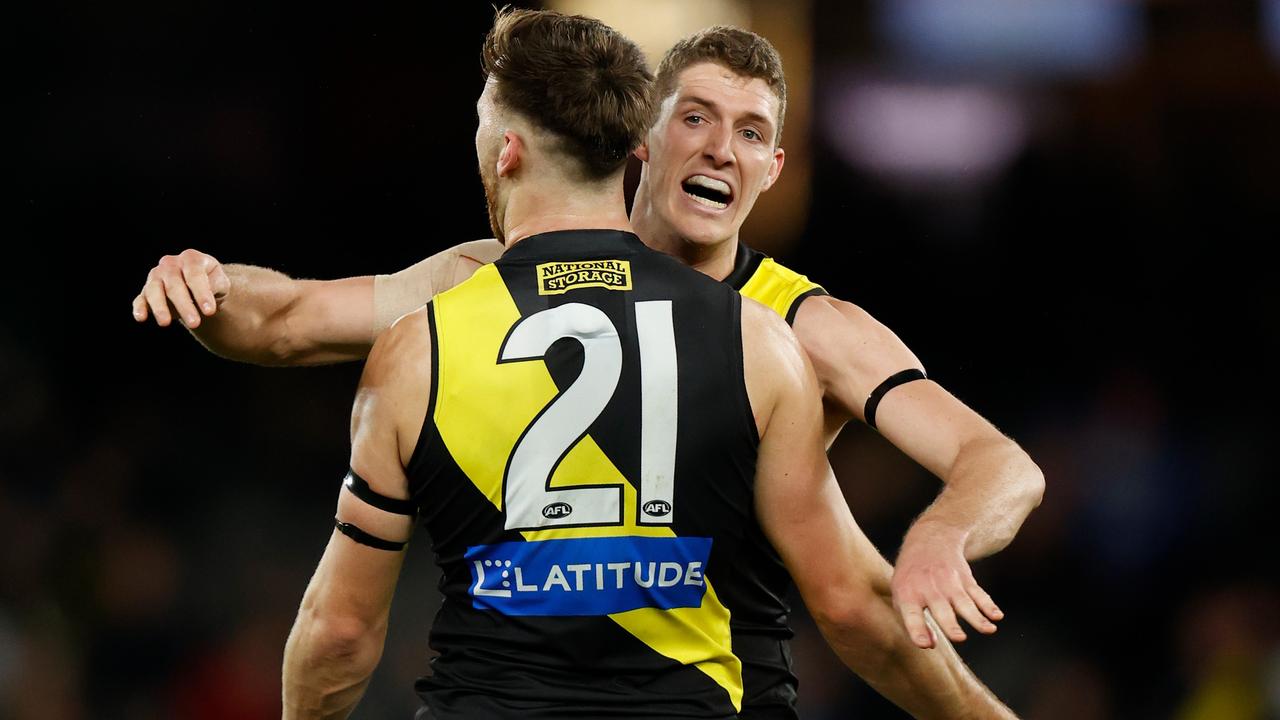 MELBOURNE, AUSTRALIA - JULY 16: Noah Balta (left) and Ben Miller of the Tigers celebrate during the 2022 AFL Round 18 match between the North Melbourne Kangaroos and the Richmond Tigers at Marvel Stadium on July 16, 2022 in Melbourne, Australia. (Photo by Michael Willson/AFL Photos via Getty Images)