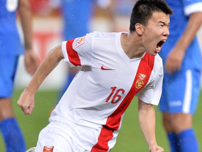 BRISBANE, AUSTRALIA - JANUARY 14: Sun Ke of China celebrates after scoring a goal during the 2015 Asian Cup match between China PR and Uzbekistan at Suncorp Stadium on January 14, 2015 in Brisbane, Australia. (Photo by Bradley Kanaris/Getty Images)