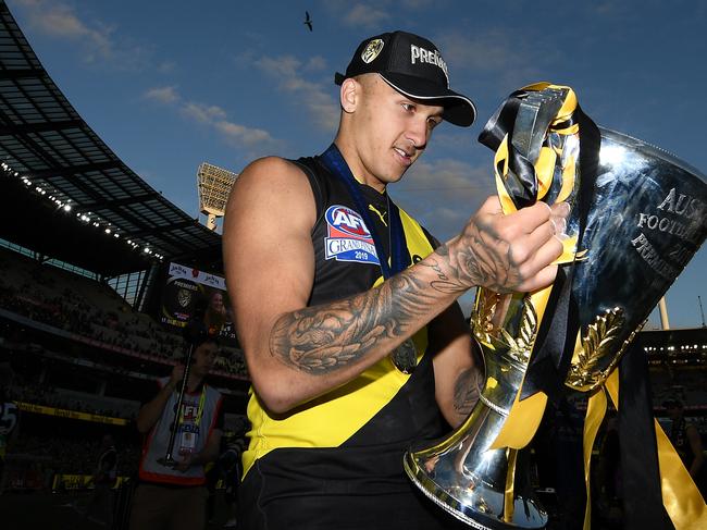 MELBOURNE, AUSTRALIA - SEPTEMBER 28: Shai Bolton of the Tigers   celebrates with the Premiership Trophy during the 2019 AFL Grand Final match between the Richmond Tigers and the Greater Western Sydney Giants at Melbourne Cricket Ground on September 28, 2019 in Melbourne, Australia. (Photo by Quinn Rooney/Getty Images)