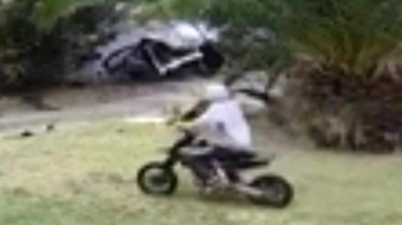 A dirt bike rider can be seen approaching the crash immediately after, before riding away.