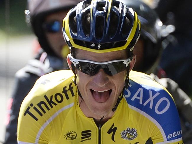 Australia's Micheal Rogers is cheered by fans as he competes on his way to win the 20th stage of the Giro d'Italia, Tour of Italy cycling race, from Maniago to Monte Zoncolan, Italy, Saturday, May 31, 2014. Nairo Quintana virtually clinched the Giro d'Italia title Saturday with a strong ride up the demanding Monte Zoncolan, while Michael Rogers benefited from a fan interruption to post his second stage victory of the race. (AP Photo/Fabio Ferrari)