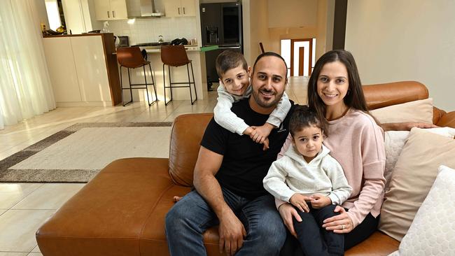 Ramee and Reem Rizk, with their children Joey, 5, and Leon, 2, are trying to save money to help with mortgage interest rate rises. Picture: Lyndon Mechielsen/Courier Mail