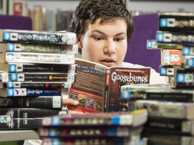 LIVERPOOL LEADER. Hoxton Park High School is participating in this year's Premier's Reading Challenge.  Year 8 student Andrew Walker 13 photographed today 26th August 2019 with books on the list. (AAP/Image Matthew Vasilescu)