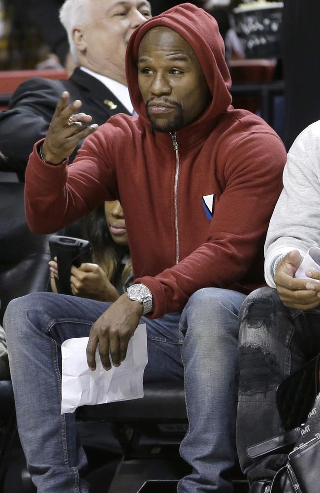 Floyd Mayweather attends an NBA game in Miami.