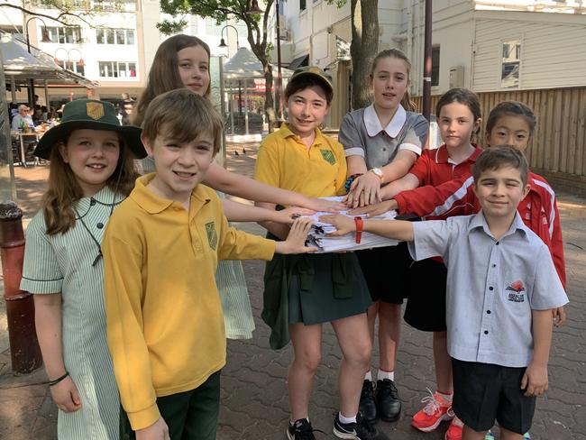 Children from Cammeray Public School and Anzac Park Public School with the petition.