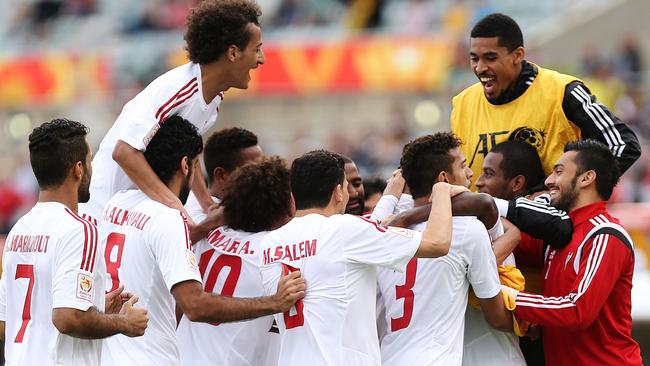 CANBERRA, AUSTRALIA - JANUARY 11: United Arab Emirates players celebrate a goal during the 2015 Asian Cup match between the United Arab Emirates and Qatar at Canberra Stadium on January 11, 2015 in Canberra, Australia. (Photo by Stefan Postles/Getty Images)