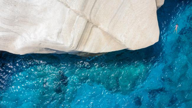 Sarakiniko Beach - Milos Island
Slip, slop, slap before you head to this rocky beach. At Sarakiniko Beach, put your towel down on stark, volcanic white rocks, which jut out into the bright blue sea.