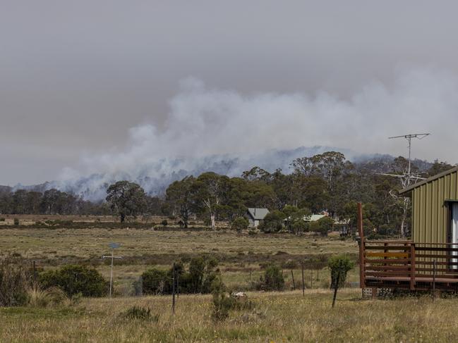 Back burning operations in the hills near Miena, which remains on high alert. Picture: HEATH HOLDEN