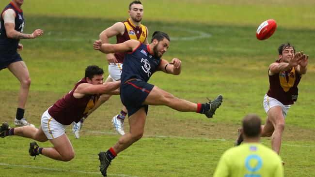 Sam Raru kicks the ball for Springvale Districts. Picture: Stuart Milligan