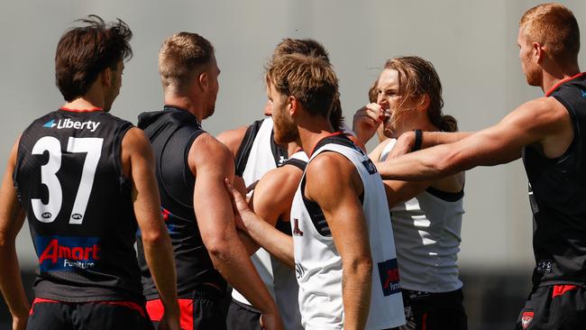 Jake Stringer (left) and teammate Mason Redman are separated after a fiery encounter at pre-season training. (Photo by Michael Willson/AFL Photos via Getty Images)