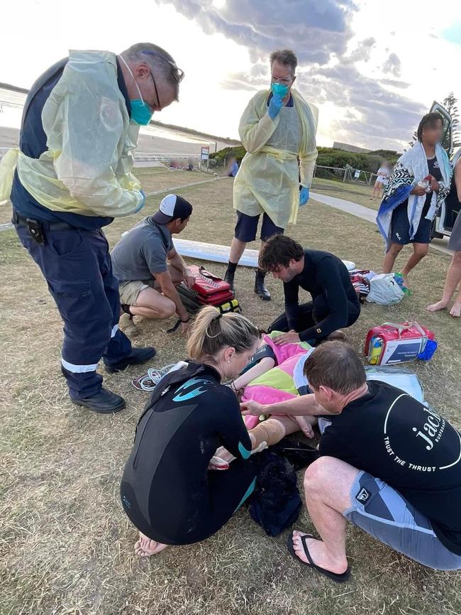 Lifeguards and surfers rescued two teens from waters at Ocean Grove beach on Monday following a shark attack. Picture: Facebook