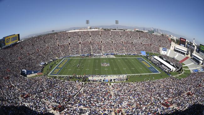 The Los Angeles Memorial Coliseum is seen with downtown Los Angeles.