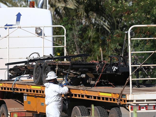 The chasis of the caravan being removed where father of two Charlie Hinder died with his children Nyobi and River. Picture: Jack Tran / The Courier Mail