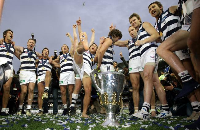 Mathew Stokes kicks up his heels at the MCG as the Cats players celebrate the 2007 Grand Final victory over Port Adelaide. Picture: David Caird