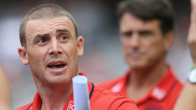 Simon Goodwin takes the quarter-time team talk as Paul Roos watches on. Picture: Wayne Ludbey