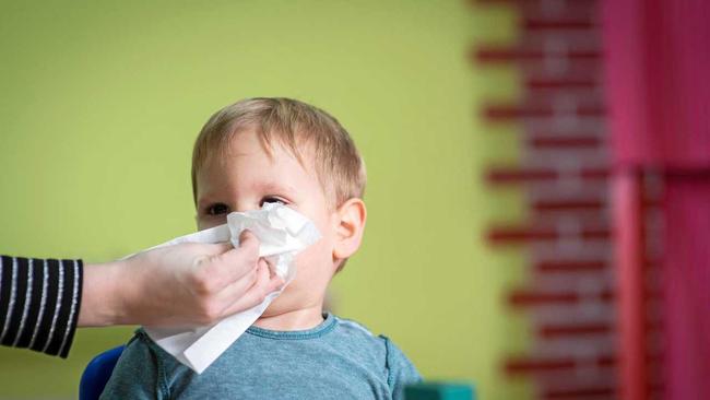 Come on sweetie, let's wipe that obvious snot away before I drop you off at child care. Picture: Thinkstock