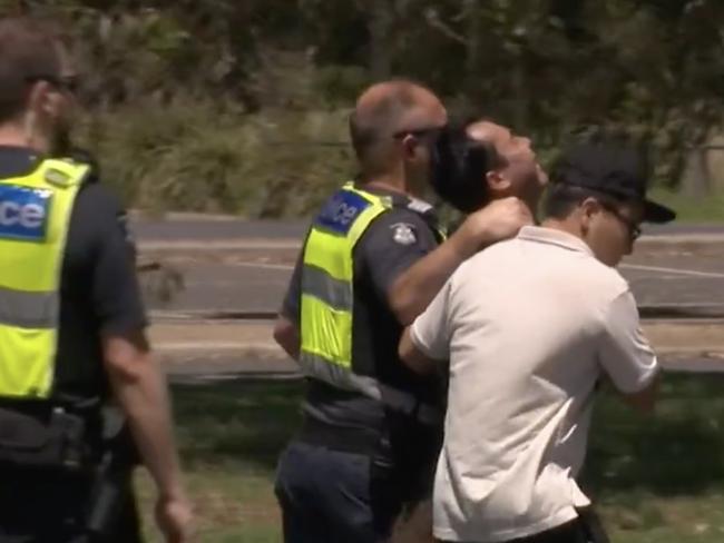 Police console grieving relatives at the scene. Picture: 9 News