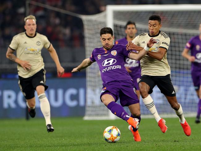 Perth Glory recruit Bruno Fornaroli (left) holds off Jesse Lingard of Manchester United. Pic: AAP