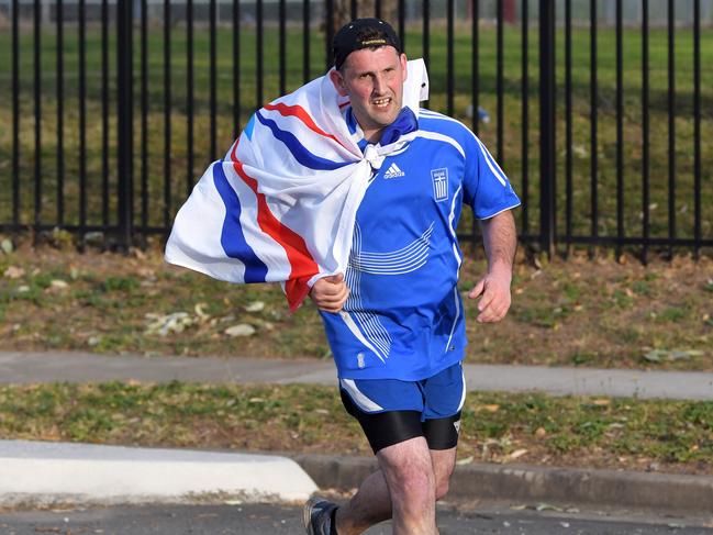 Victorian runner Isak Ketsakitis arrives at St Hurmizd's Cathedral, Greenfield Park.