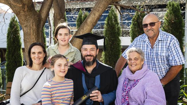 Bachelor of Engineering Science graduate Tim Parfitt with family (from left) Lisa, Abby and Conor Parfitt and Chris and Geoff Davidson at a UniSQ graduation ceremony at Empire Theatres, Wednesday, June 28, 2023. Picture: Kevin Farmer