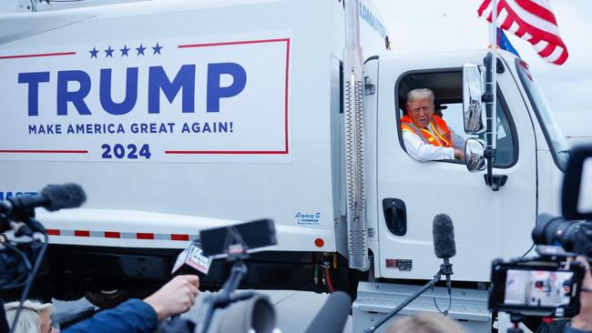 ... and holding a press conference from inside a garbage truck. Picture: Chip Somodevilla/Getty Images/AFP