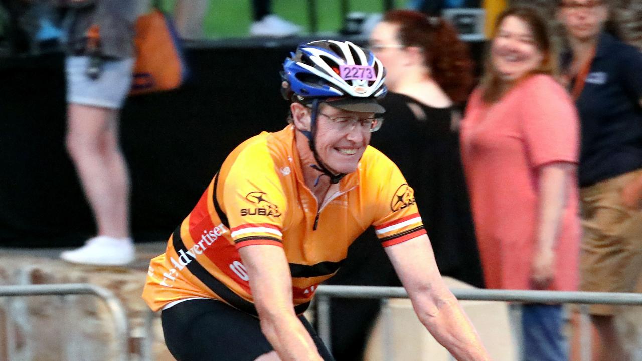 The very last rider to leave Glenelg at the start of the event at 6am, for the moment has a big smile on his face. (AAP Image/Dean Martin)